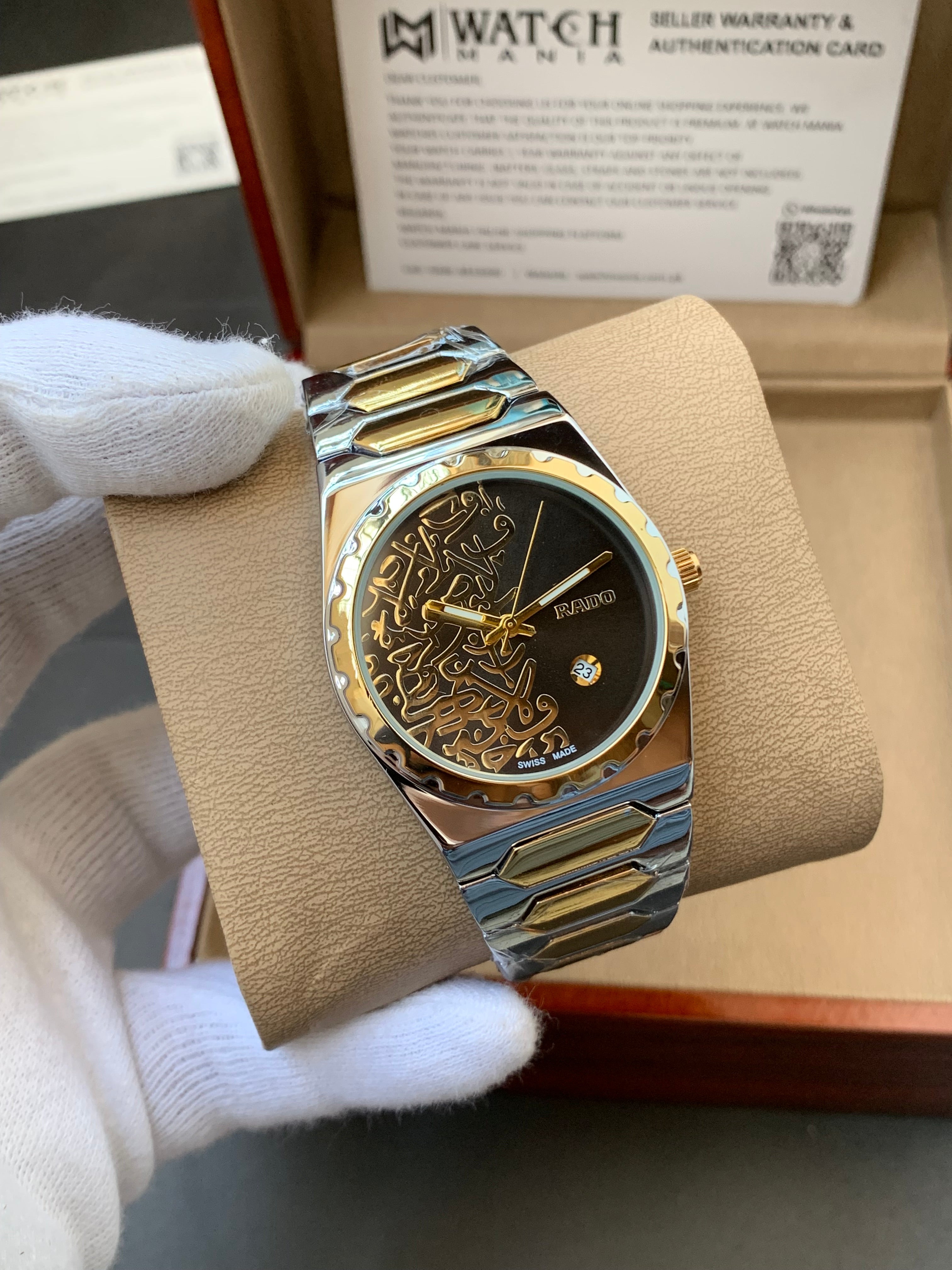 Luxury watch with intricate design held by a gloved hand, brand name visible